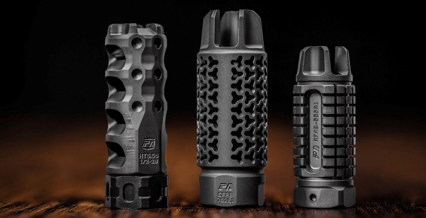 Precision Armament Hypertap&reg;, EFAB&reg;, and AFAB&reg; on a dark wooden table and a dark blurry background