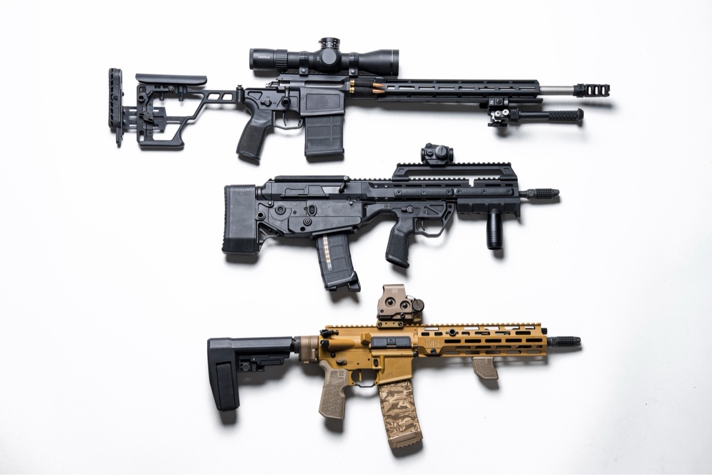 Three rifles with Precision Armament Muzzle Devices: (top to bottom) Hypertap&reg;, EFAB&reg;, AFAB&reg;